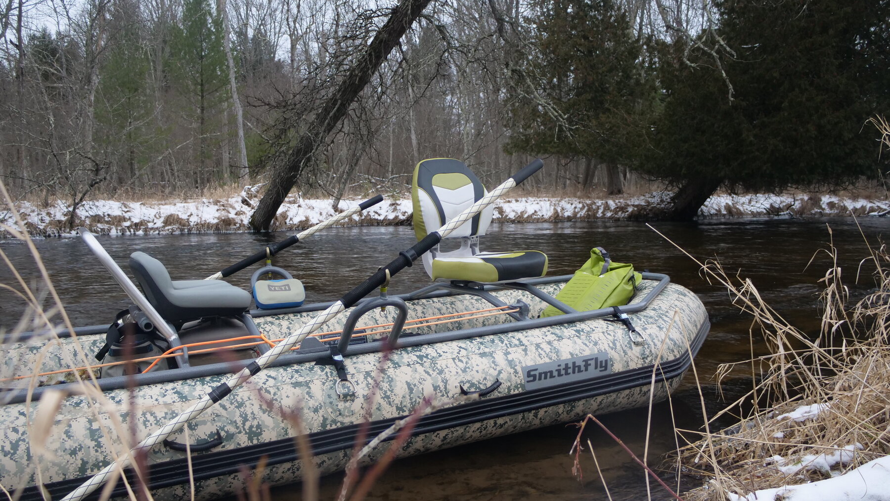 Close-up of a SmithFly raft frame and camo tube in a river